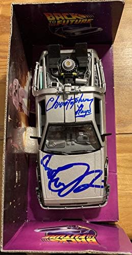 Michael J Fox Christopher Lloyd Povratak u buduće potpisali su delorejski automobil sa COA-om